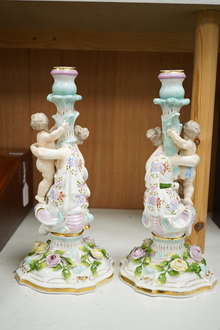 A pair of Jacob Petit porcelain figural candlesticks, 34cm